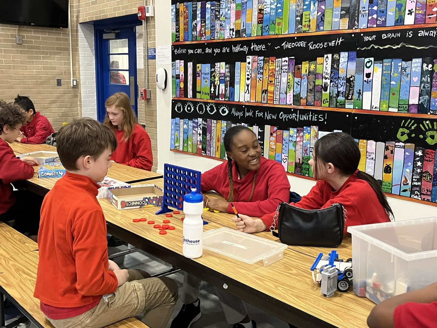 Happy students in school library