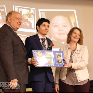 Networks Student standing with the Christina SD Superintendent and CSD Board Member